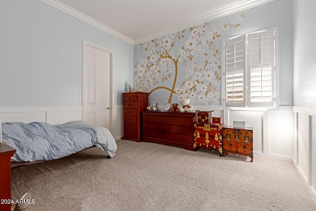 bedroom with ornamental molding and carpet floors