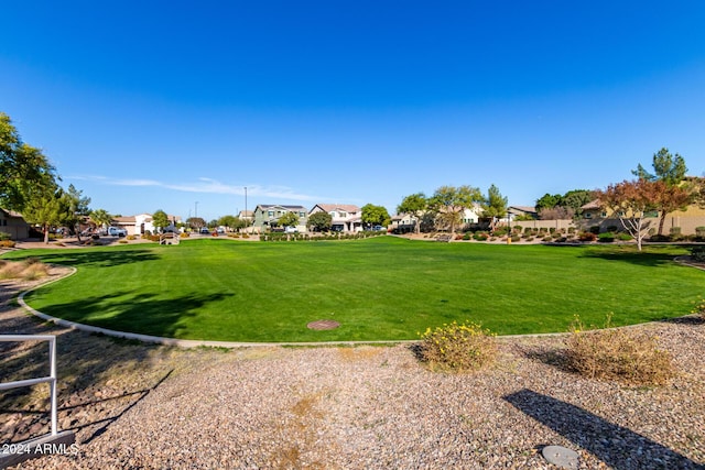 view of property's community featuring a yard