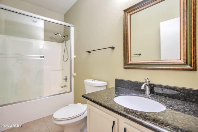 full bathroom featuring enclosed tub / shower combo, vanity, tile patterned floors, and toilet