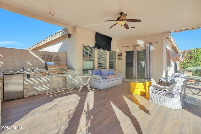 view of patio / terrace with a grill, exterior kitchen, and an outdoor living space