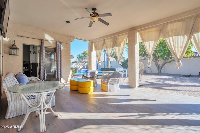 view of patio / terrace featuring ceiling fan and an outdoor hangout area