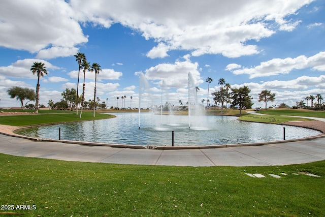 view of property's community featuring a water view and a lawn