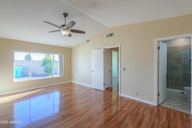 spare room with ceiling fan, wood-type flooring, and lofted ceiling