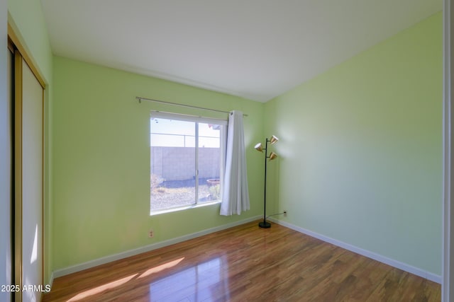 spare room featuring hardwood / wood-style flooring