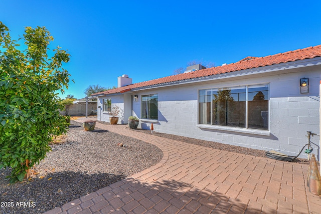 back of house with a patio