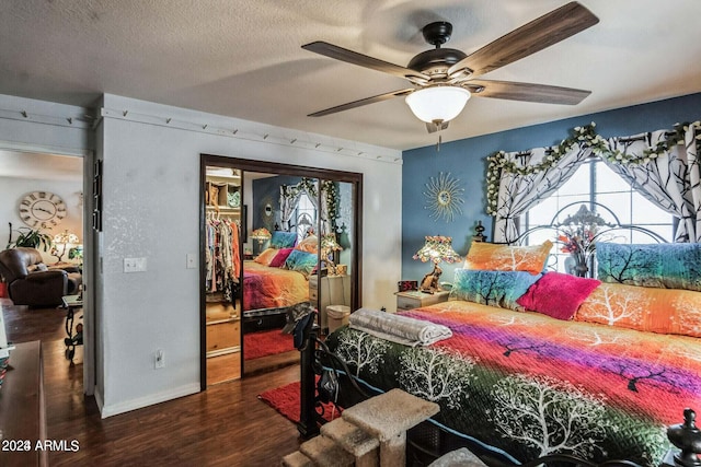 bedroom featuring a closet, ceiling fan, a textured ceiling, and dark hardwood / wood-style floors