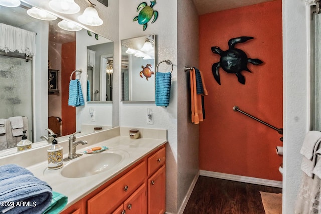 bathroom with vanity and hardwood / wood-style floors