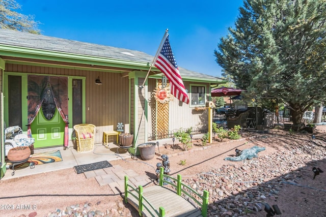 back of property with a patio