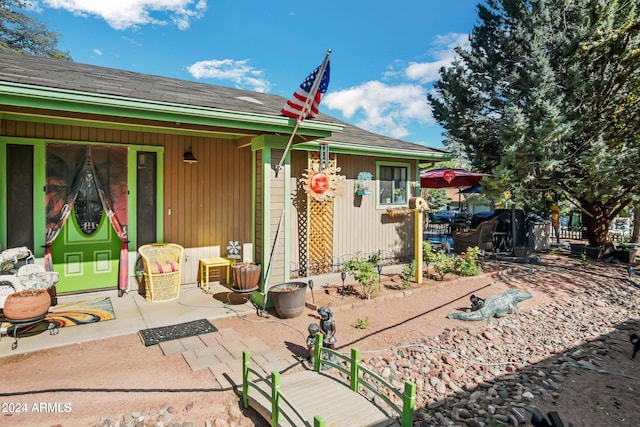 back of property featuring a patio area