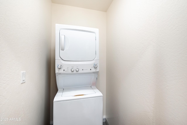 laundry room featuring stacked washer / dryer