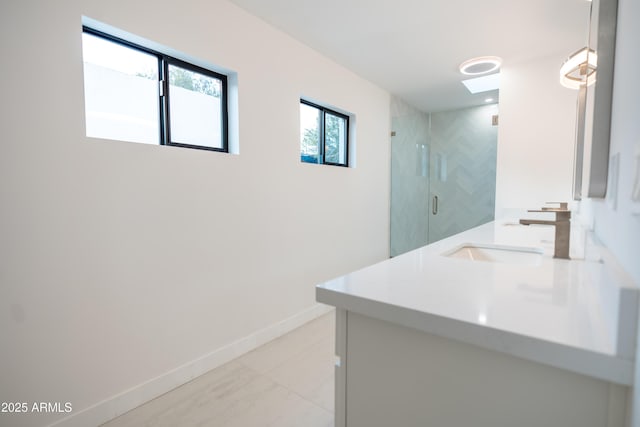 bathroom with vanity and a shower with shower door