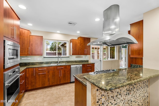 315 E Marlette Ave, Phoenix, AZ 85012 - kitchen with visible vents, island range hood, appliances with stainless steel finishes, a sink, and dark stone counters