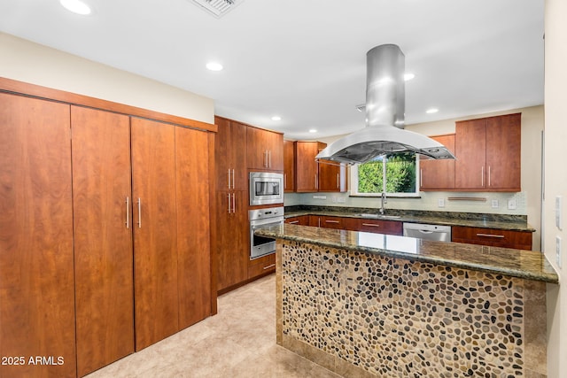315 E Marlette Ave, Phoenix, AZ 85012 - kitchen with island exhaust hood, appliances with stainless steel finishes, a sink, dark stone counters, and recessed lighting