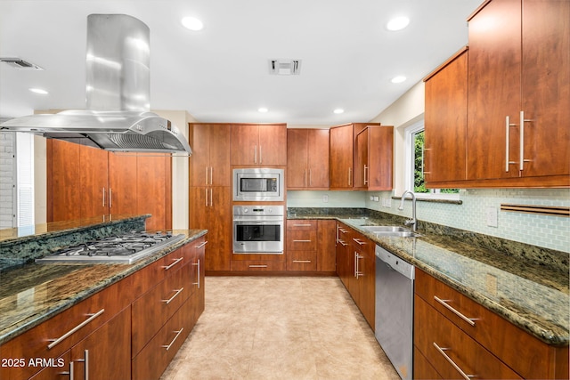 315 E Marlette Ave, Phoenix, AZ 85012 - kitchen with backsplash, island exhaust hood, visible vents, appliances with stainless steel finishes, and a sink