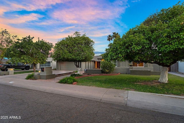 315 E Marlette Ave, Phoenix, AZ 85012 - view of front of home featuring a garage, concrete driveway, and a front yard