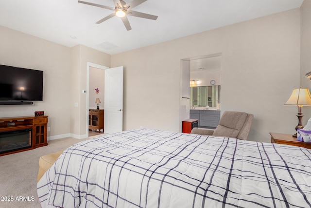 carpeted bedroom with ceiling fan and connected bathroom