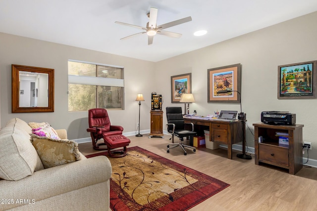 office area with ceiling fan and light hardwood / wood-style flooring