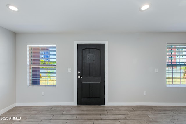 entrance foyer featuring recessed lighting and baseboards