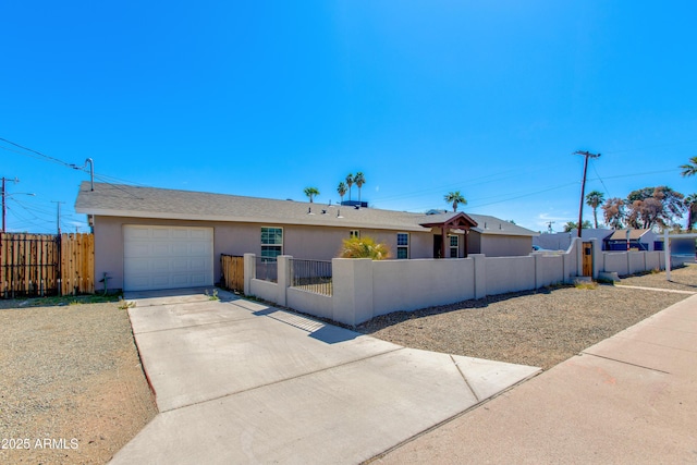 single story home featuring stucco siding, driveway, a gate, a fenced front yard, and a garage