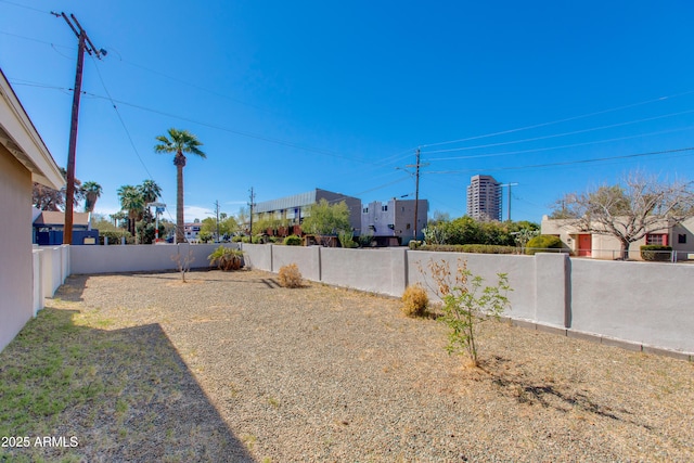 view of yard with a fenced backyard