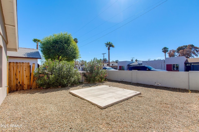 view of yard with a fenced backyard and a patio area