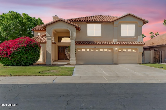 mediterranean / spanish-style house featuring a garage