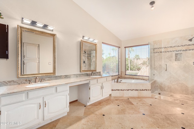 bathroom with tile patterned flooring, vanity, plus walk in shower, and vaulted ceiling