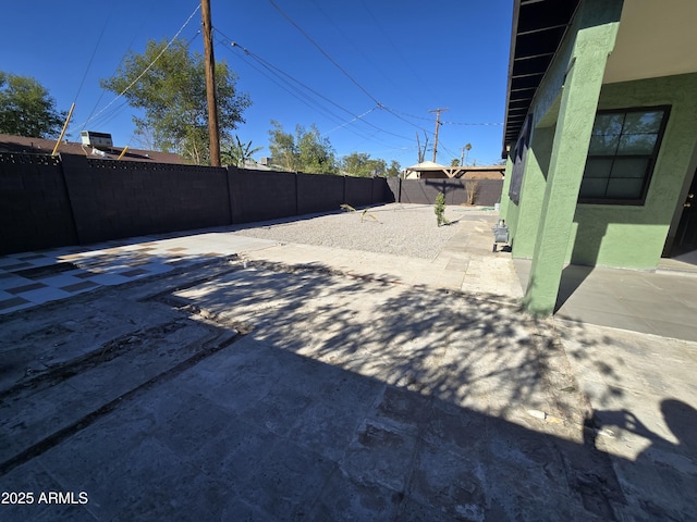 view of yard featuring a patio and a fenced backyard