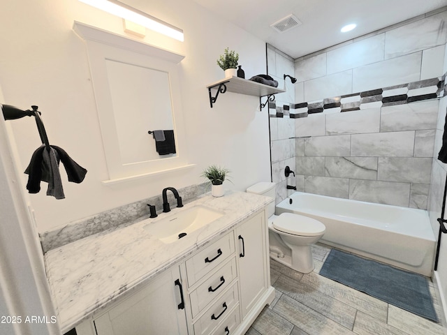 bathroom with toilet, visible vents, tub / shower combination, and vanity