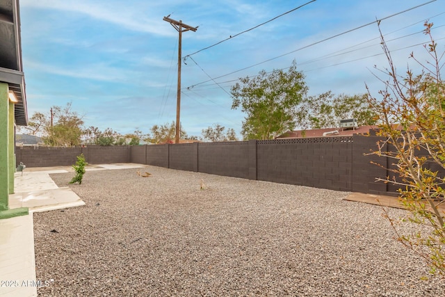 view of yard featuring a fenced backyard and a patio