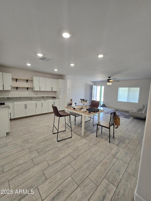 recreation room with recessed lighting, visible vents, a ceiling fan, and wood finish floors