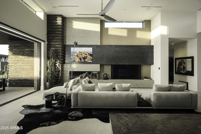 living room featuring a towering ceiling and ceiling fan