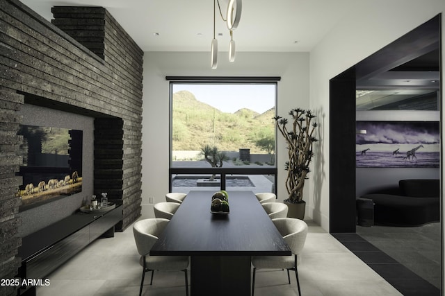 dining room featuring a mountain view