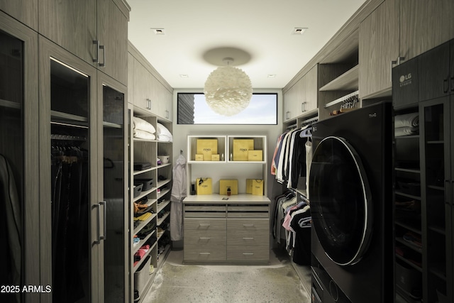 walk in closet featuring washer / dryer