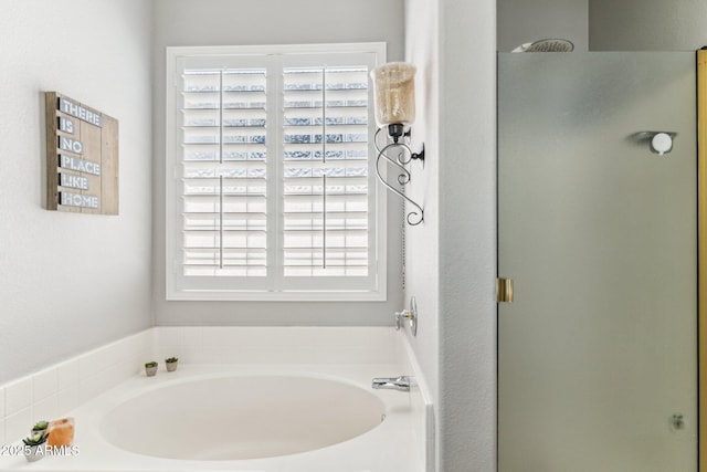 full bath with a shower stall and a garden tub