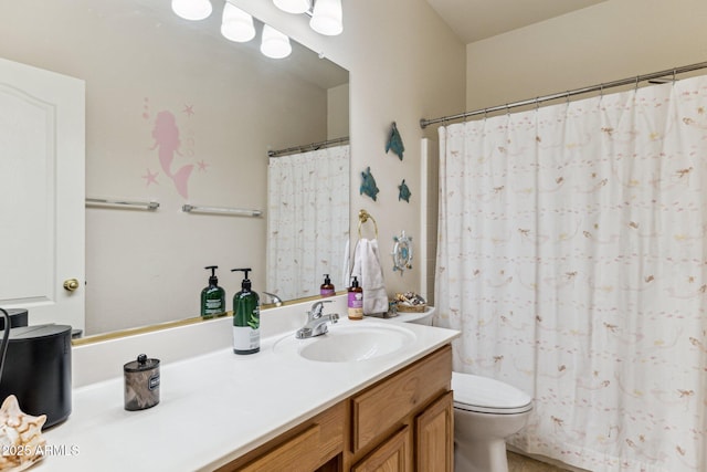 bathroom with toilet, curtained shower, and vanity