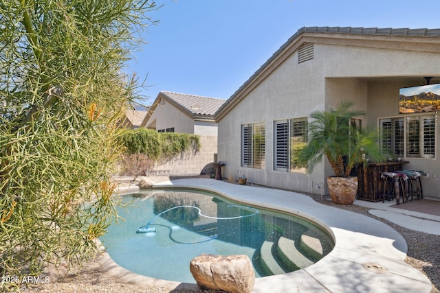 view of pool with a fenced in pool, a patio, and fence