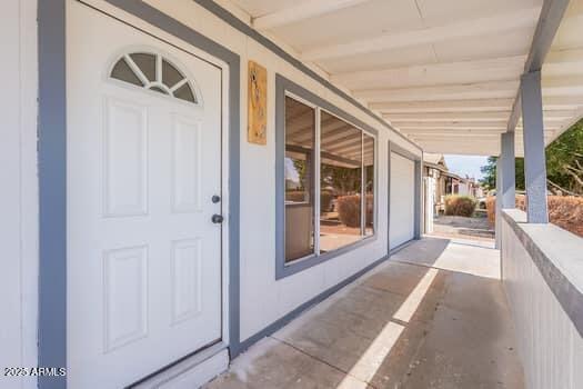 doorway to property with covered porch