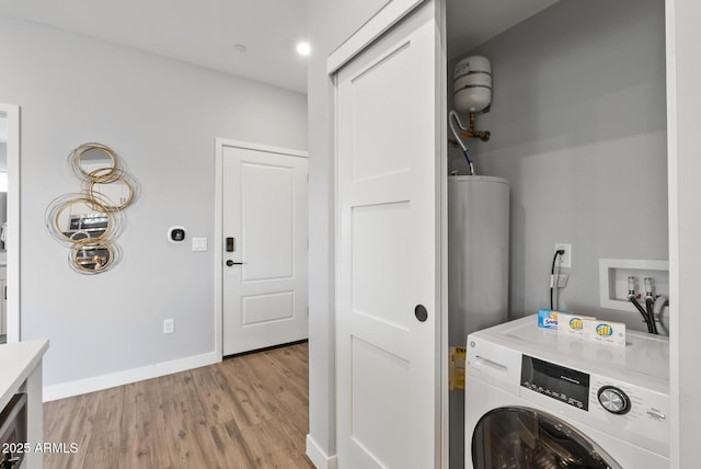 475 N 9th St Unit 206, Phoenix, AZ 85006 - washroom featuring washer / clothes dryer, light wood-type flooring, water heater, and baseboards