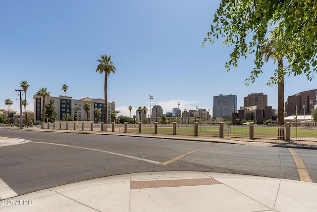 475 N 9th St Unit 206, Phoenix, AZ 85006 - view of asphalt street with sidewalks, curbs, a skyline view, and street lights