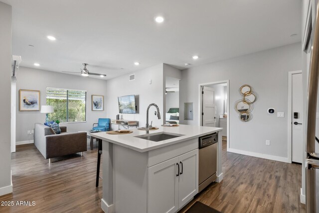 475 N 9th St Unit 206, Phoenix, AZ 85006 - kitchen with open floor plan, stainless steel dishwasher, a sink, a ceiling fan, and dark wood finished floors