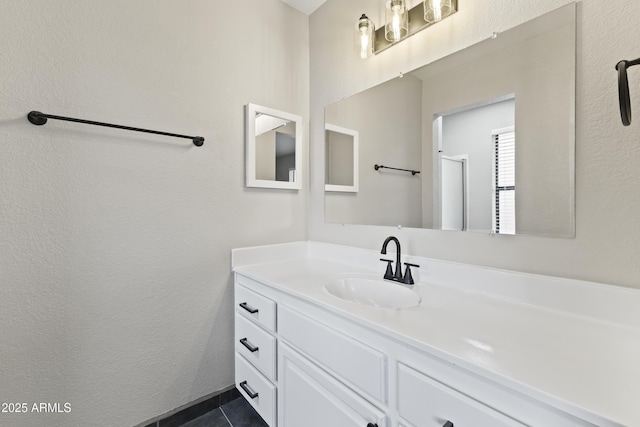 bathroom with tile patterned flooring and vanity