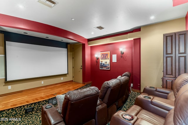 home theater room featuring hardwood / wood-style floors