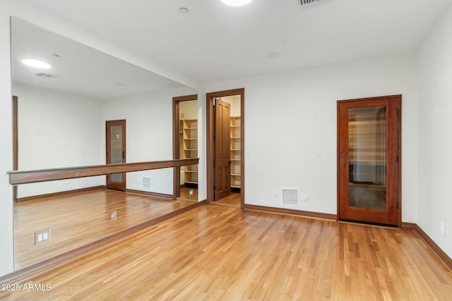 spare room with light hardwood / wood-style floors