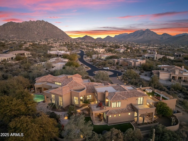 aerial view at dusk with a mountain view