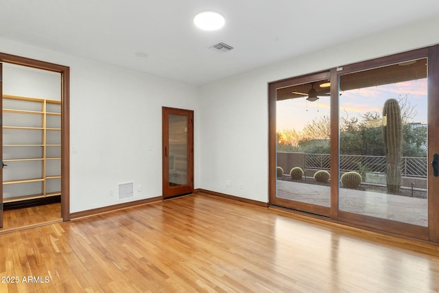 spare room with light hardwood / wood-style floors