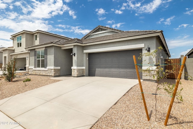 view of front of home with a garage