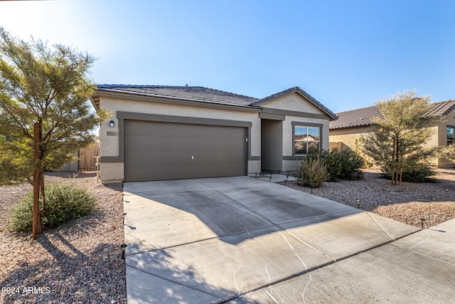 ranch-style home with a garage