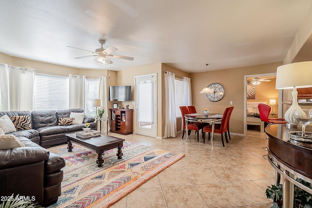 17017 N 12th St Unit 1106, Phoenix, AZ 85022 - living room with ceiling fan, light tile patterned flooring, and baseboards