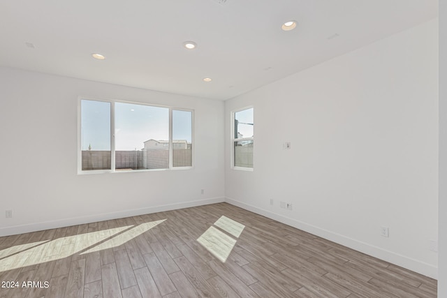 unfurnished room featuring light hardwood / wood-style floors